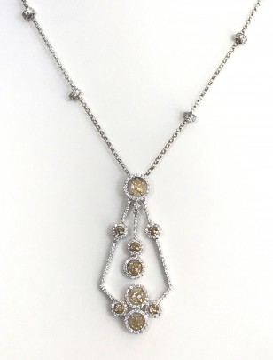 18k White Gold and Diamond Pendant, set with 9 yellow diamonds and 159 round diamonds and 4 diamond roundels on an 18k gold chain.